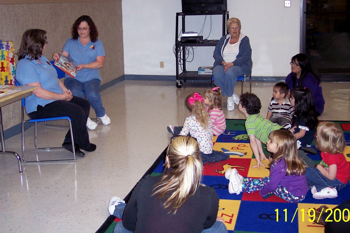 Cuddlebugs listening to story