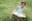 Little reader in grass