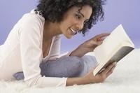 Woman reading on stomach